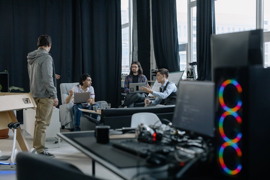 Professionals engaged in a meeting at a modern office.